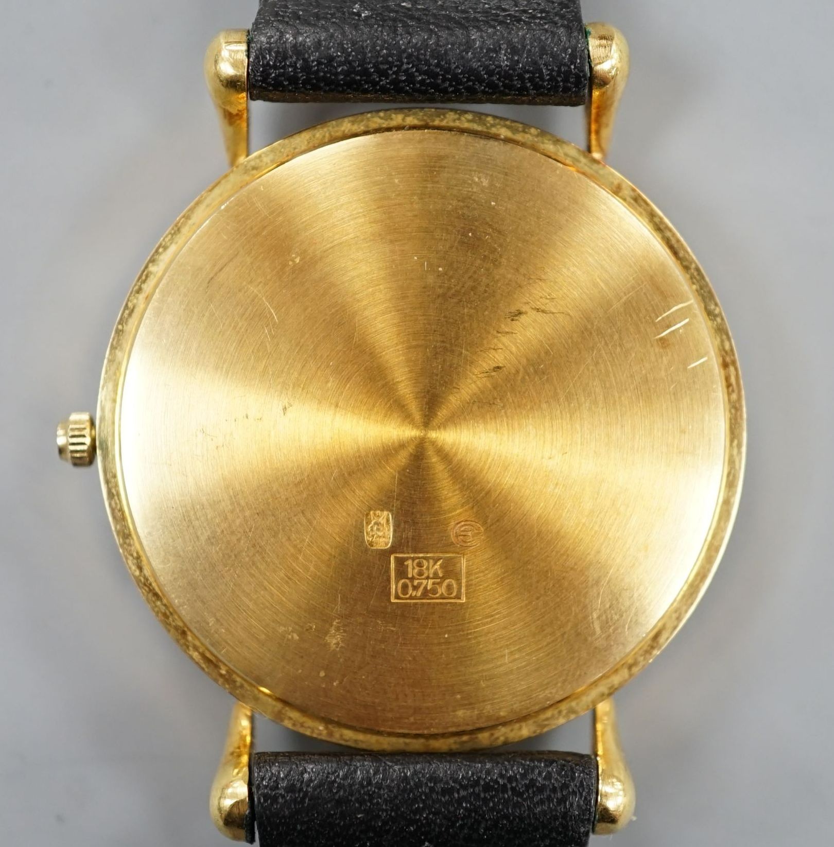 A modern 18k Mathey-Tissot calendar moonphase quartz wrist watch, on a black leather strap, no box or papers.